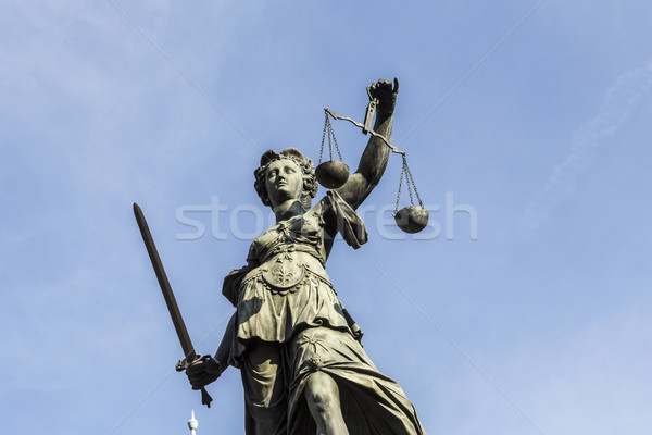 Stock photo: lady justice  under blue sky