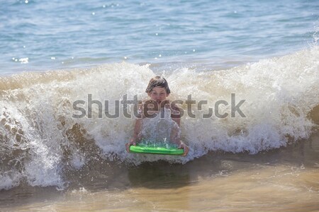 Ragazzo divertimento spiaggia tavola da surf sorriso faccia Foto d'archivio © meinzahn