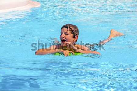 boy swimming in the pool Stock photo © meinzahn