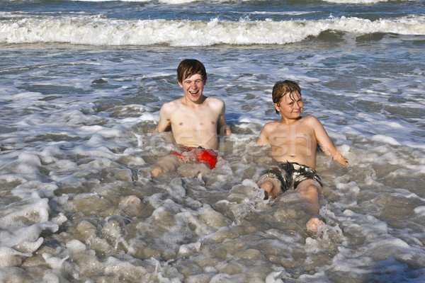 boys have fun in the beautiful clear sea Stock photo © meinzahn