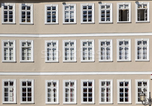 facade of old house with wooden windows in row Stock photo © meinzahn