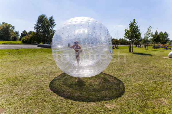 child has fun in the Zorbing Ball  Stock photo © meinzahn