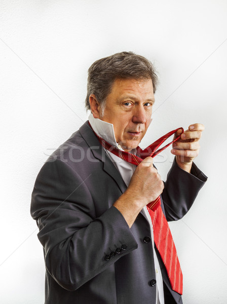 business man binding his tie Stock photo © meinzahn