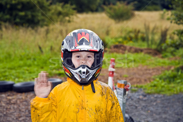 happy boy with helmet at the kart trail Stock photo © meinzahn