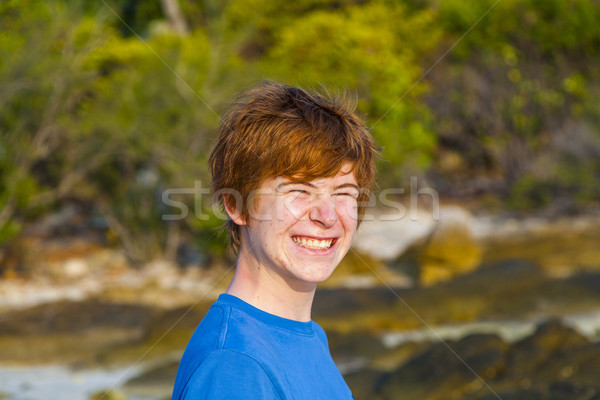cute boy at the tropical beach with funny face Stock photo © meinzahn