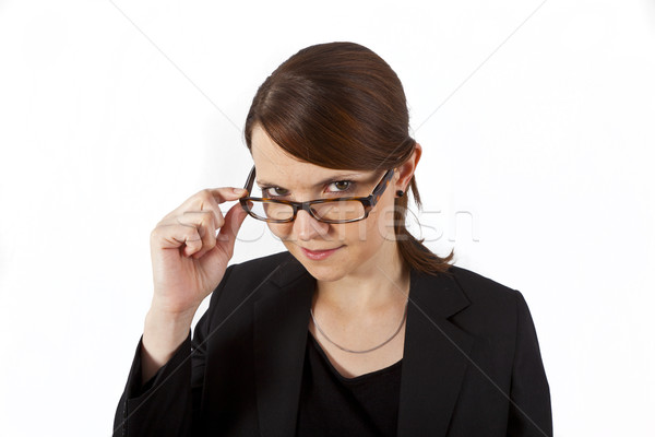 Business woman lächelnd schauen ernst isoliert weiß Stock foto © meinzahn