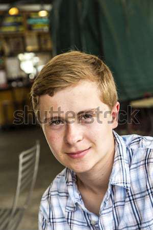 boy with red hair and pickax in the face looks happy  Stock photo © meinzahn