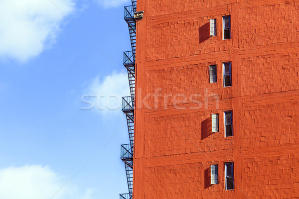 fire escape ladder at an old brick skyscraper  Stock photo © meinzahn