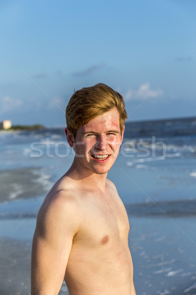 handsome confident teenager in sunset at the beach Stock photo © meinzahn