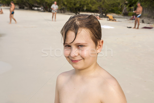 young happy boy with brown wet hair is smiling and enjoying the  Stock photo © meinzahn