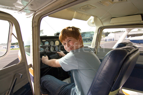Fiú pilóta ülés repülőtér repülőgép jókedv Stock fotó © meinzahn