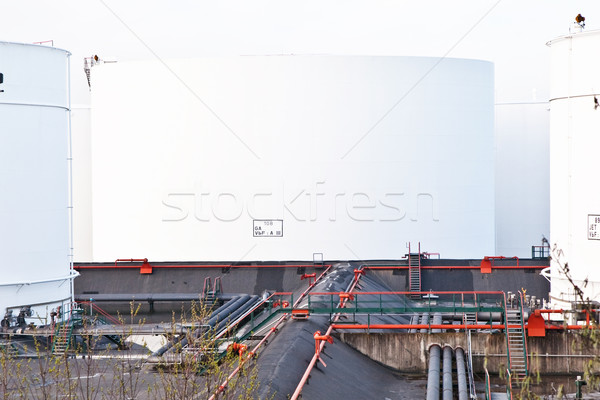 white tanks for petrol and oil in tank farm with blue sky Stock photo © meinzahn