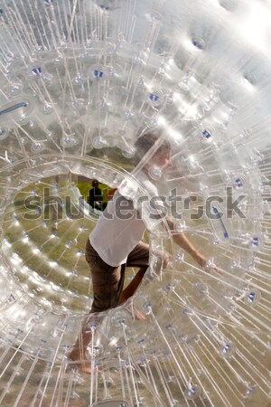 Stock photo: cute child has a lot of fun in the Zorbing Ball