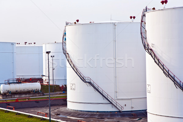 white tanks for petrol and oil in tank farm with blue sky Stock photo © meinzahn