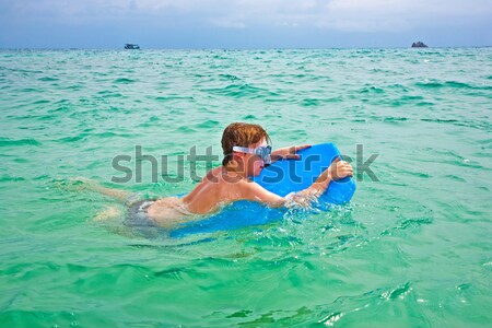 boys having fun in the  sea playing piggyback Stock photo © meinzahn