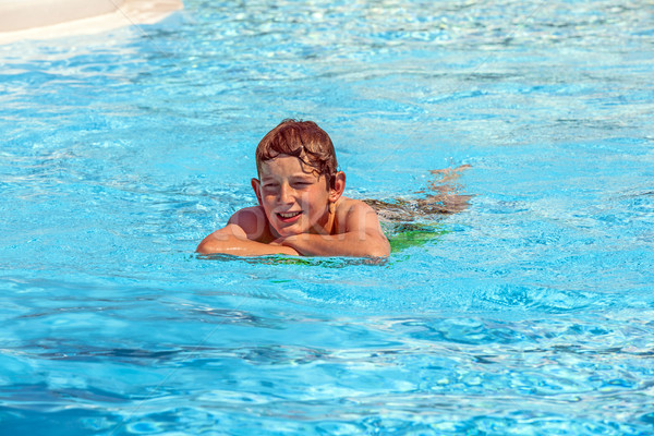 boy in the pool relaxing  Stock photo © meinzahn
