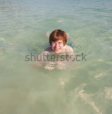 boy swimming in the beautiful clear ocean  Stock photo © meinzahn