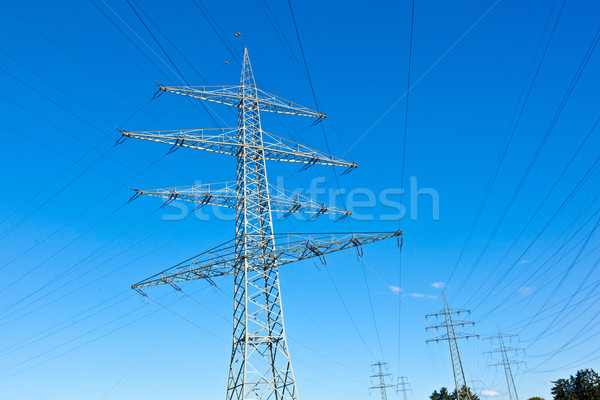 Steel electricity pylon on bright blue sky  Stock photo © meinzahn