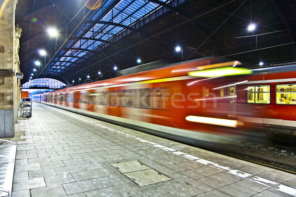 Train im motion enters the station Stock photo © meinzahn