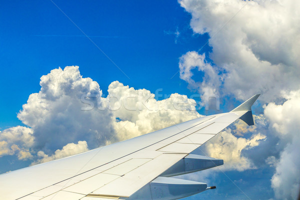 airplane flying in the sky with clouds  Stock photo © meinzahn