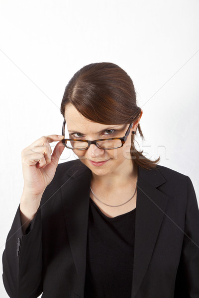 Business woman lächelnd schauen ernst isoliert weiß Stock foto © meinzahn