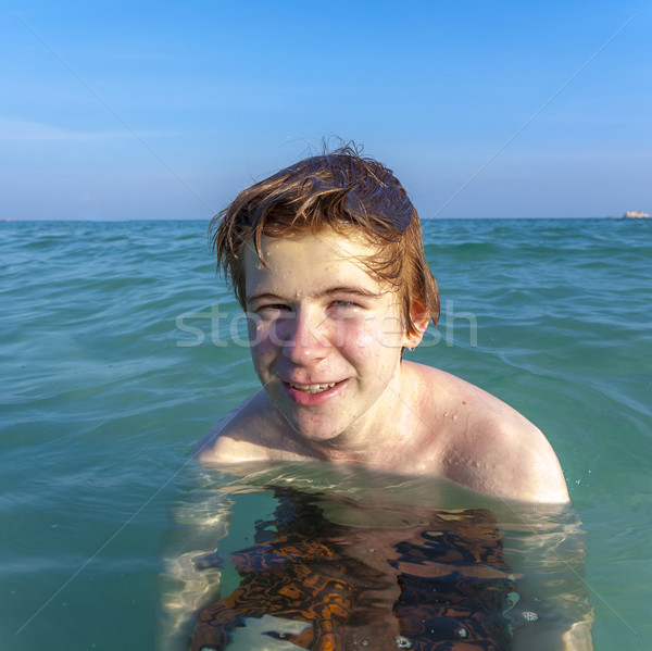 boy with red hair is enjoying the ocean Stock photo © meinzahn