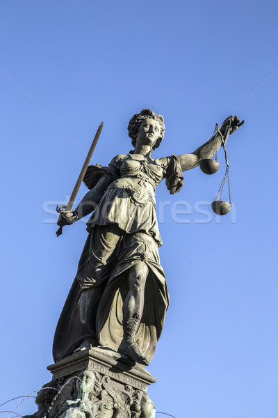 Justitia - Lady Justice sculpture on the Roemerberg square Stock photo © meinzahn