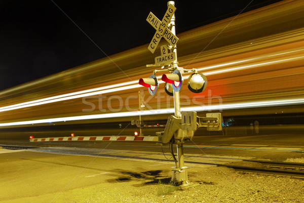 train passes a crailway crossing by night at route 66 Stock photo © meinzahn