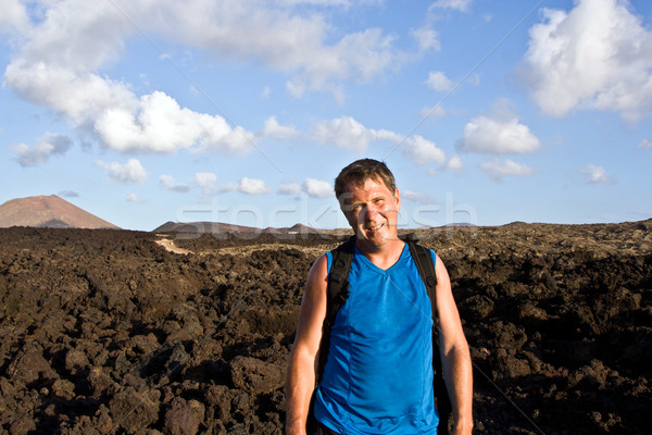 man walking in lava field  Stock photo © meinzahn