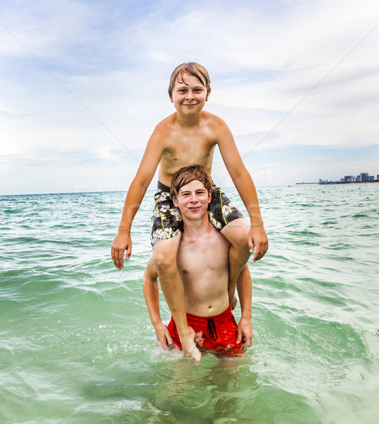 boys having fun in the ocean Stock photo © meinzahn