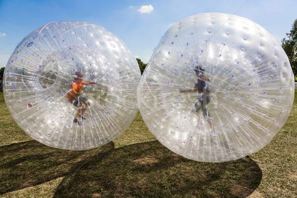 children have fun in the Zorbing Ball  Stock photo © meinzahn