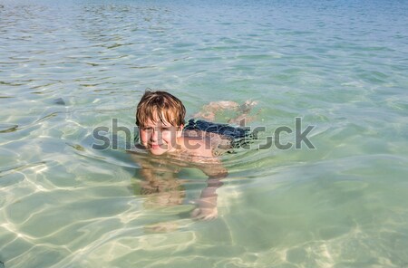 boy swimming in the clear ocean Stock photo © meinzahn