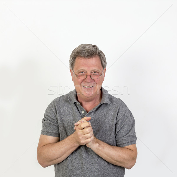 Mosolyog érett férfi szürke pólóing portré kéz Stock fotó © meinzahn