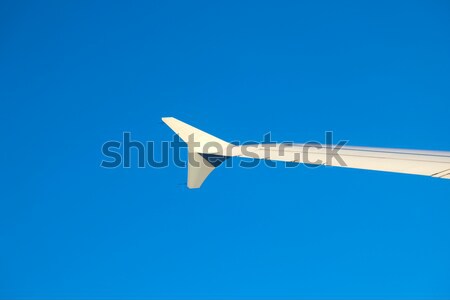 Asa aeronave céu pôr do sol luz fundo Foto stock © meinzahn