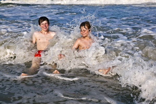boys having fun in the beautiful clear sea Stock photo © meinzahn
