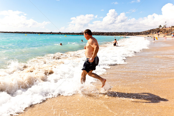 man running at the beach  Stock photo © meinzahn