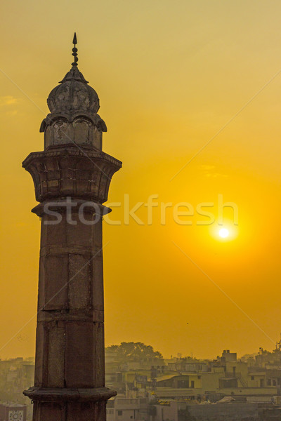 Minaret Delhi reggel nap égbolt templom Stock fotó © meinzahn