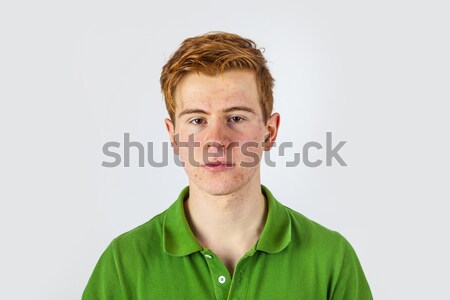 cool boy in green shirt with red hair Stock photo © meinzahn