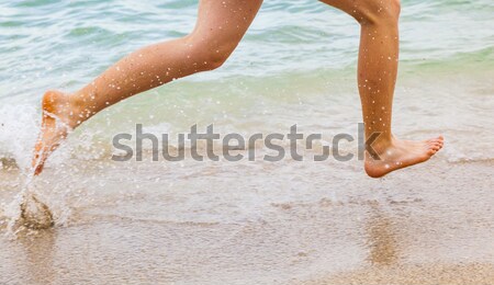 腳 男孩 運行 海灘 水 太陽 商業照片 © meinzahn