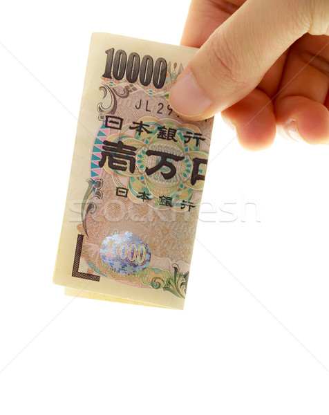Japanisch yen Hand halten zehn tausend Stock foto © Melpomene