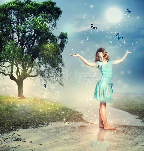 Stock photo: Girl with Blue Butterflies at a Magical Brook