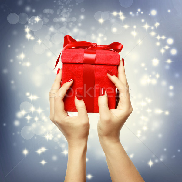 Red present box on Christmas on shinning background Stock photo © Melpomene
