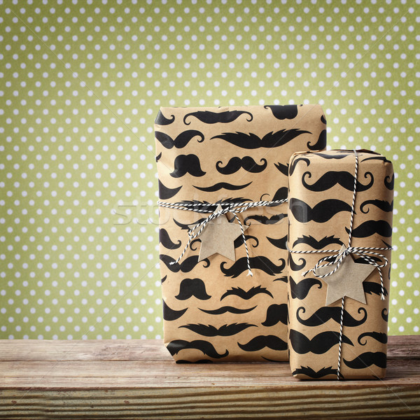 Mustache pattered gift boxes with star shaped tags  Stock photo © Melpomene
