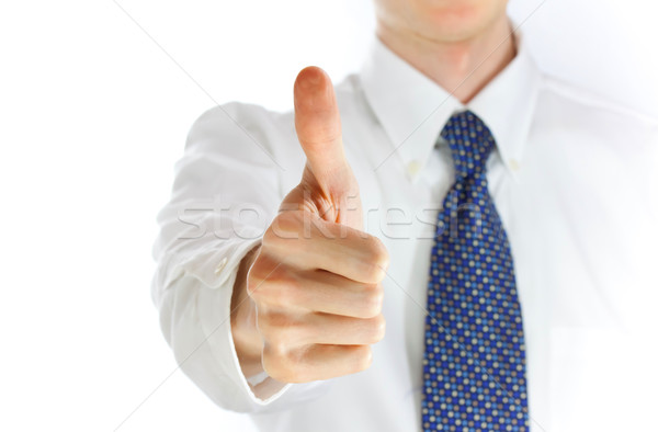 Young businessman showing thumb up Stock photo © Melpomene
