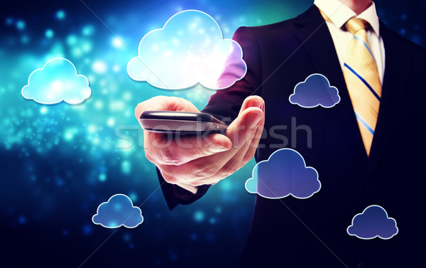 Okostelefon felhő konnektivitás szolgáltatás üzletember tart Stock fotó © Melpomene