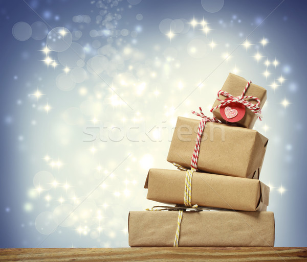 Stack of handmade gift boxes over snowing night Stock photo © Melpomene