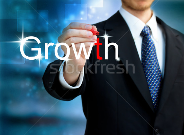 Jonge zakenman schrijven woord groei Rood Stockfoto © Melpomene