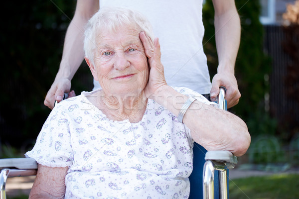 Feliz senior senhora cadeira de rodas cuidador família Foto stock © Melpomene