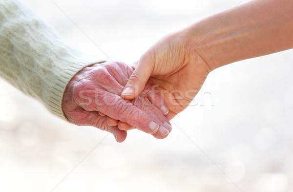 Idős fiatal kéz a kézben fényes fehér kezek Stock fotó © Melpomene