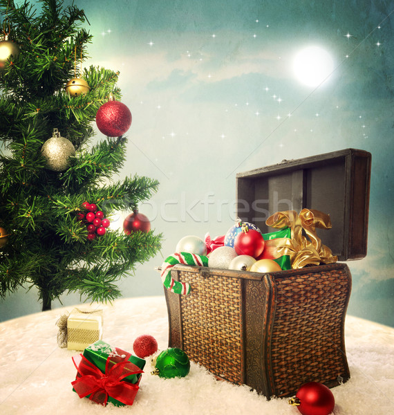 Treasure box filled with Christmas ornaments and presents Stock photo © Melpomene